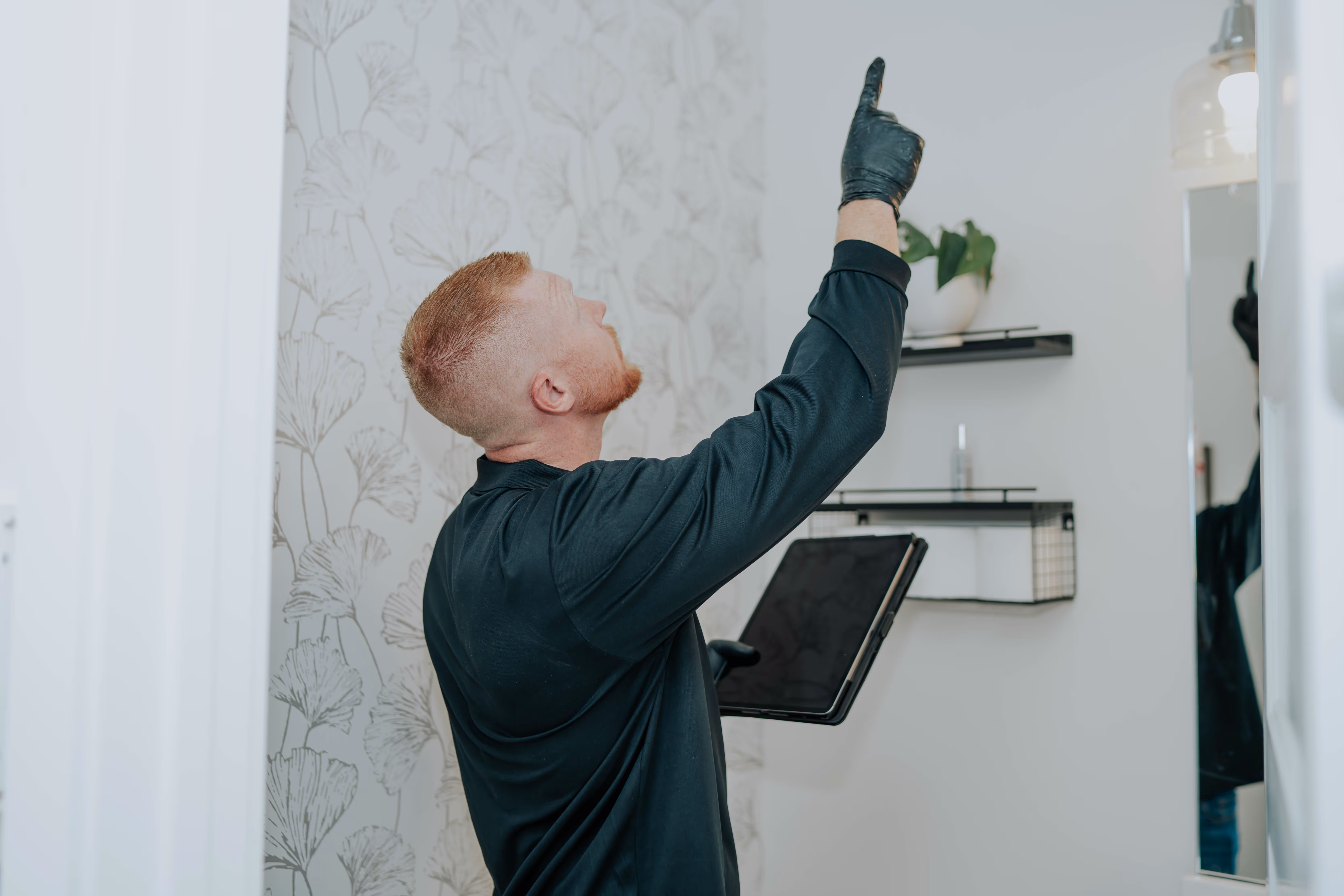 Pure Maintenance Mold Removal specialist inspecting a property